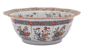 A Chinese famille verte decagonal bowl: finely enamelled overall with flowering shrubs and sprays,