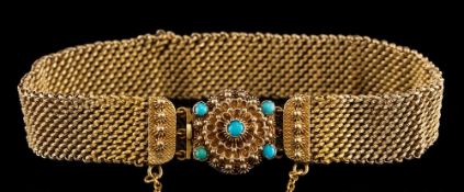 A turquoise bracelet,