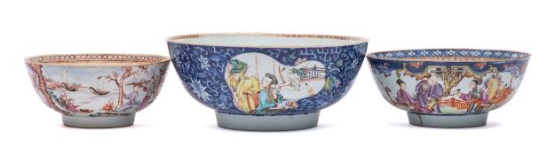 A group of three Chinese famille rose bowls: variously painted with panels of figures on lakeside