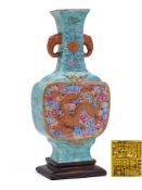 A Chinese famille rose dragon vase: of flattened baluster form with elephant head handles,