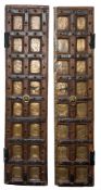 A pair of Indian hardwood and iron mounted, studded and panelled doors:,