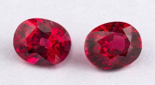 Two un-set rubies,: the oval cut rubies, stated to weigh 0.80 carats and 0.68 carats.