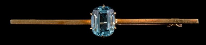 An aquamarine bar brooch,: the rectangular cut aquamarine in a claw setting,