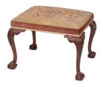 A carved mahogany frame rectangular stool in the George II taste:,