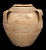 * Bernard Leach [1887-1979] a stoneware vase: of oviform with three simple lug handles,