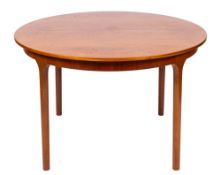 A mid 20th Century circular teak dining table and four chairs by A H McIntosh & Co.