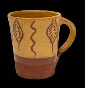 WITHDRAWN LOT * Bernard Leach [1887-1979] a terracotta mug: dipped in mustard slips and