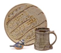 A group of studio pottery: comprising a Mike Dodds stoneware plate decorated with finger trails and