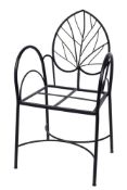 A 20th Century wrought iron open armchair,