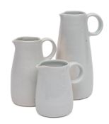 *John Davidson [1936-2005] three graduating porcelain jugs: of tapering cylindrical form,