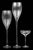 Three monumental wine glasses: comprising two flutes and a champagne bowl, 121, 100 and 46cm high.