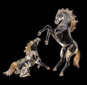 Two Murano glass equestrian figures: modelled in clear glass with some gold inclusions,