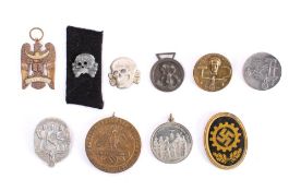 A group of German day badges: including 'Tag Der Arbeit 1934', tag Der Arbeit 1935',