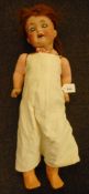 An early 20th century bisque head doll by Heubach Kopplesdorf: applied wig over blue glass