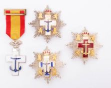 A Spanish Order of Naval Merit Star with white distinction,: together with a similar example,
