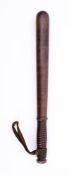 A late Victorian police truncheon: decorated with 'VR' on a plain body an ribbed grip with leather