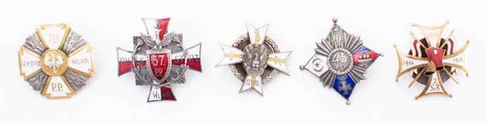 A collection of Polish metal and enamel Regimental association badges: includes,