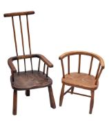 A late 19th century Child's beech and elm stick back open armchair: on three shaped legs,