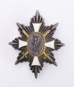 A German Hamburg Cross: the eight pointed star with central oval depicting a German soldier in