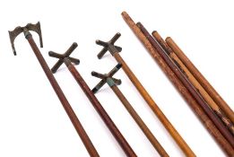 A group of early to mid 20th century snooker rests and long cues:, unsigned.
