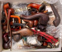 A collection of various vintage briar and meerschaum pipes: including several cased pipes,