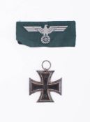 A reproduction WWI Iron Cross, Second Class: together with a later NSDAP cloth badge (2) .
