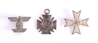 A WWI German Merit cross: together with a WWII Merit cross and an Iron Cross clasp (3) * Notes