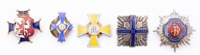 A collection of Polish metal and enamel Regimental association badges: includes,