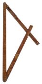 A brass mounted folding measuring stick by PB & S Ltd,: of three section with calibrated scales.
