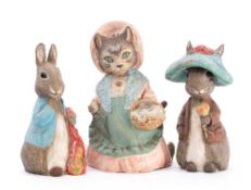 Three early 20th century Beatrix Potter advertising figures: comprising Peter Rabbit,
