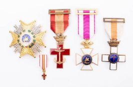A Spanish Military Long Service Badge and medal: a Spanish Naval Merit Cross and miniature and an