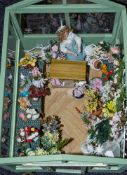 A 20th Century doll's greenhouse flower shop 'Poppies' with figure, flowers and accessories.