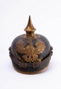 An Imperial Prussian M1891 Pattern pickelhaube: the black leather skull fitted brass spike and rear