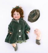 A Simon and Halbig bisque head doll: applied brown wig, blue glass sleeping eyes,