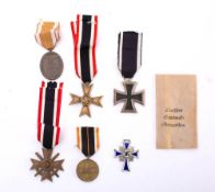 A group of six WWII German orders and decorations: comprising Wert Wall Medal,