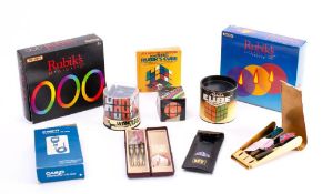 An Idel Rubik's Cube in original card container: together with two other Rubik's cube style puzzle,