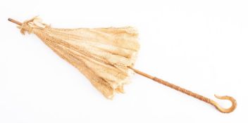 An Edwardian lace parasol with malacca shaft and carved handle: together with a 19th century