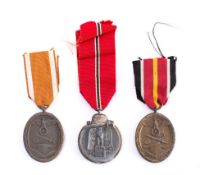 A Third Reich period Russian Front Campaign Medal 1941-42: a West Wall Defence Medal in original