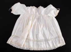 A small collection of various whitewear and textiles,: including christening gowns etc.