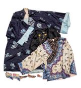 An early 20th century Chinse blue silk and embroidered jacket: with floral decoration,