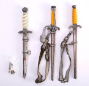 Two reproduction German Army dagger: together with a reproduction Luftwaffe dagger (scabbard in