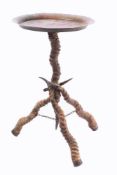 A circular brass occasional table: with antelope tripod supports, 56cm high.