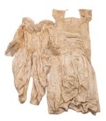 A late Victorian/early Edwardian child's cream silk dress by Baxter,