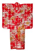 A 20th century silk Kimono: profusely embroidered with birds amongst flowers in gold and silver