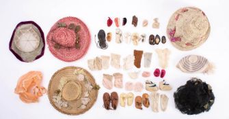 A group of seven early 20th century dolls hats together with seven pairs of dolls shoes and a