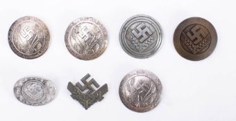 A collection of German Third Reich style RAD decorations: includes War Volunteer Service Badge,