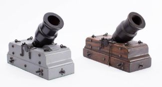A pair of scale model 13 inch mortars: overpainted black with iron work on wooden beds,