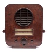 An Ecko Type AC74 Superhet radio receiver in brown Bakelite Art Deco style case:,