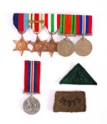 A group of six WWII service medals: together with a Royal Winnipeg Rifles cloth badge and a Buffs