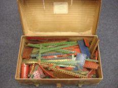 A collection of loose Meccano in an associated brown leather case: